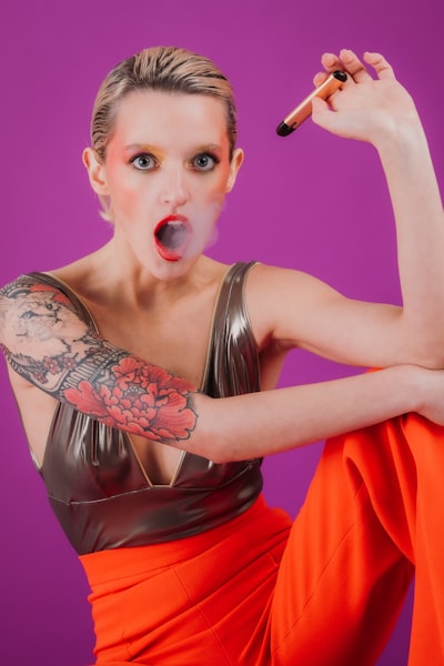 woman in red dress holding microphone